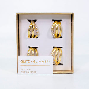 Set de servilleteros de anillos dorados en metal inoxidable, diseño elegante para decoración de mesa.