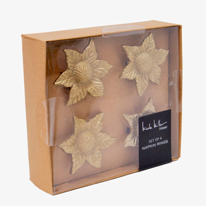 Set de servilleteros dorados en forma de girasol, diseño metálico elegante para decoración de mesa.