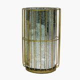 Candelabro dorado con base metálica y vidrio