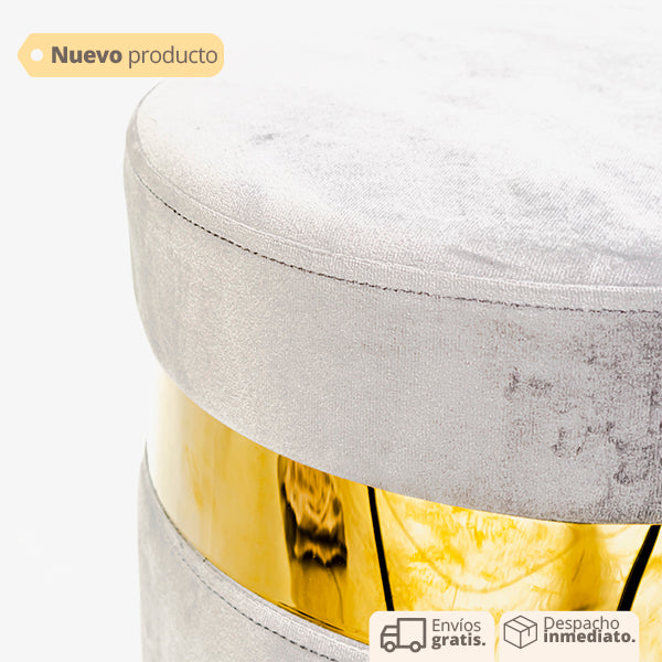 puff decorativo redondo en tela gris con base metálica
