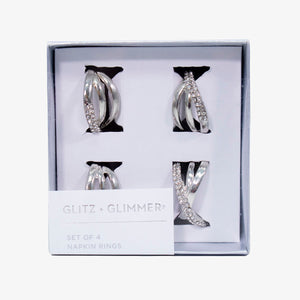 Set de servilleteros de anillos plateados en metal inoxidable, diseño elegante para decoración de mesa.
