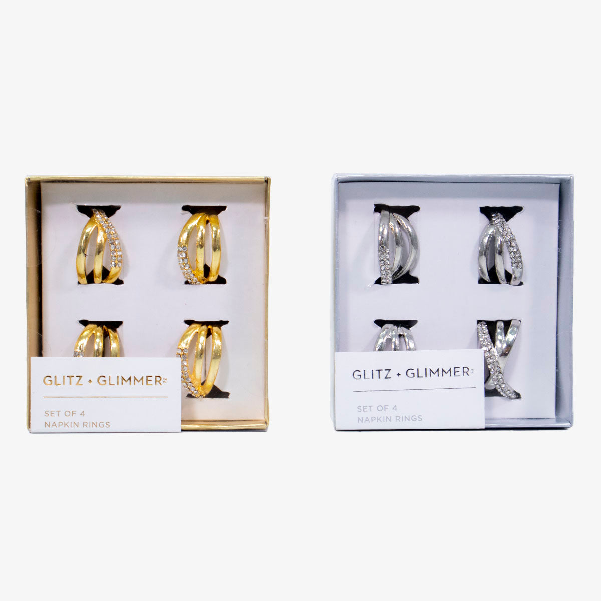 Set de servilleteros en anillos dorados y plateados en metal inoxidable, diseño elegante para decoración de mesa.